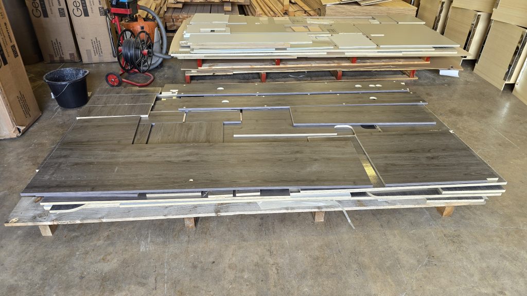 CNC-cut laminated panels stacked ready for delivery